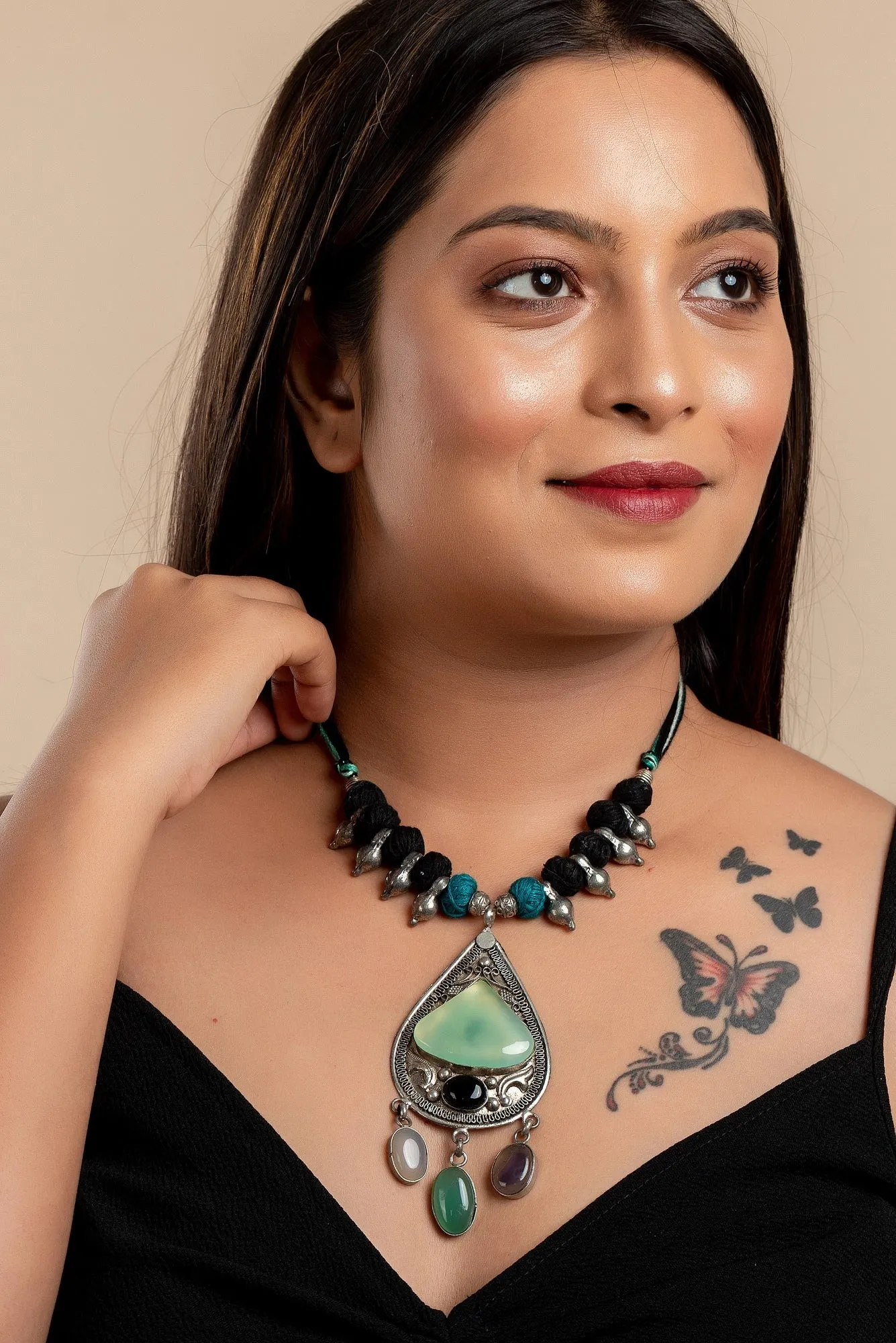 Designer Dual Tone Adjustable Cotton Dori Neckpiece with Semi Precious Stone Studded German Silver Pendant