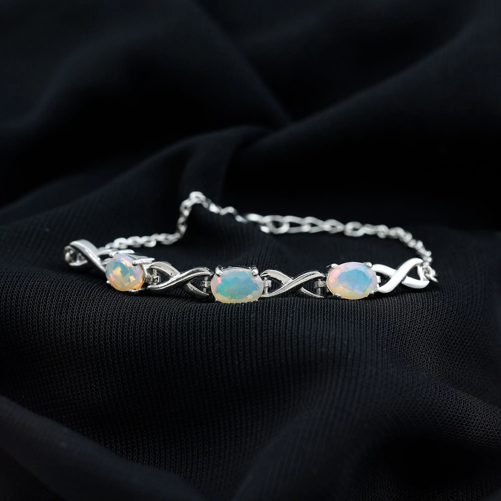 Oval Cut Ethiopian Opal Infinity Link Bolo Bracelet