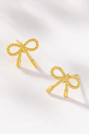 Small textured brass bow stud earrings